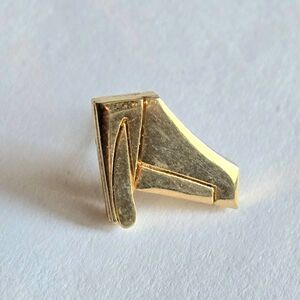 Vintage pin gold tone lapel brooch airplane tail ?